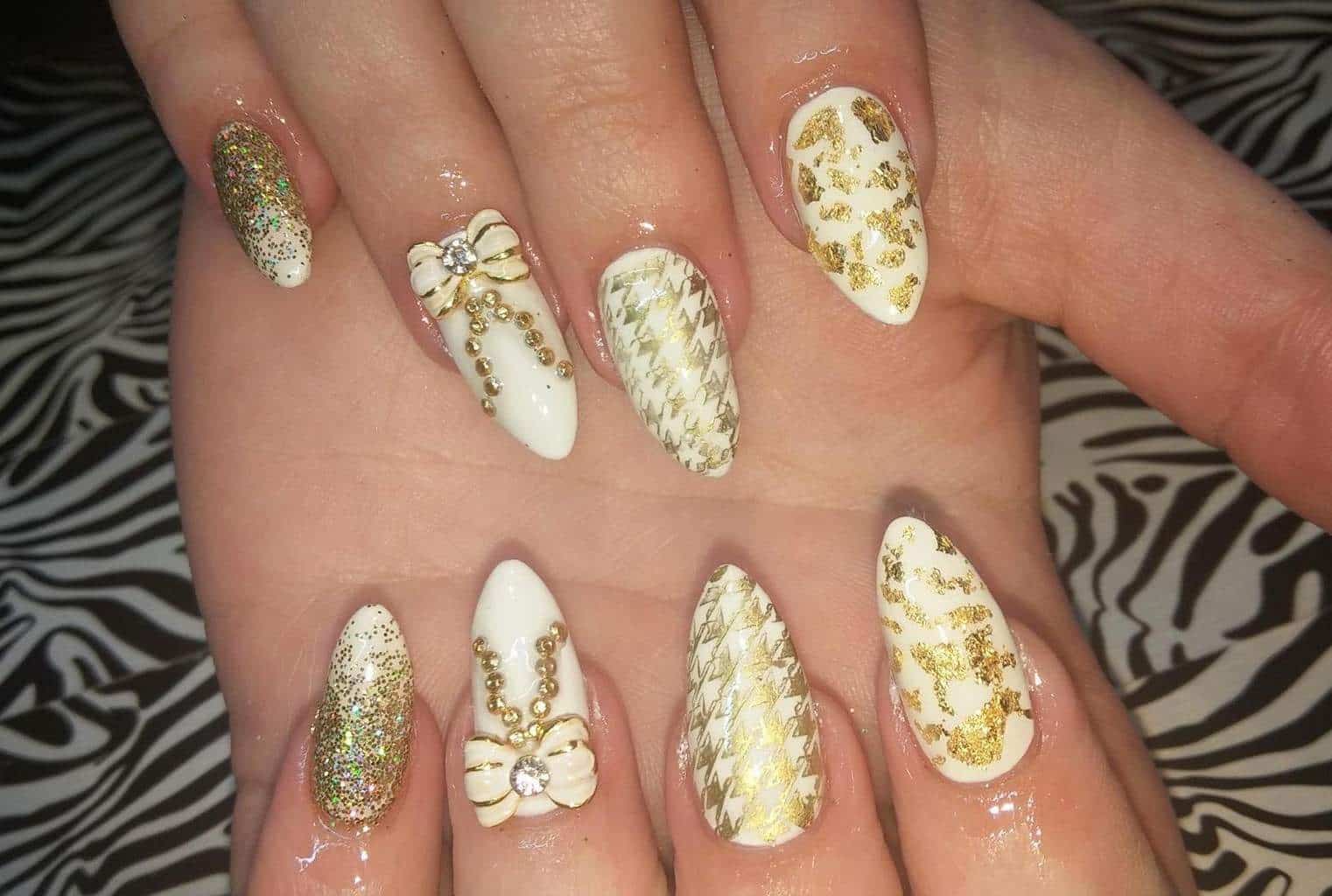 Bow Tie Style white and gold nail idea for women 
