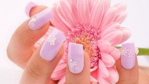 Square, medium length, pastel lavender, glossy finish, floral nail art, soft and feminine style.