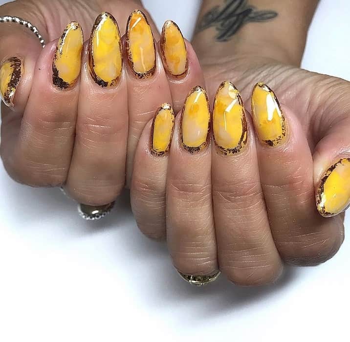yellow color marble nails