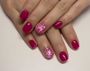 Pink and white nail design, square shape, glossy finish, floral art.
