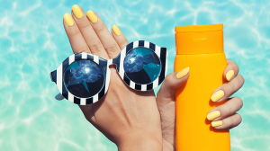 Yellow nails with glossy finish, oval shape, minimal design.