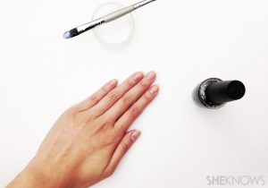 Almond-shaped nails, medium length, nude and white shades, glossy finish, minimalist style, subtle shimmer accents.