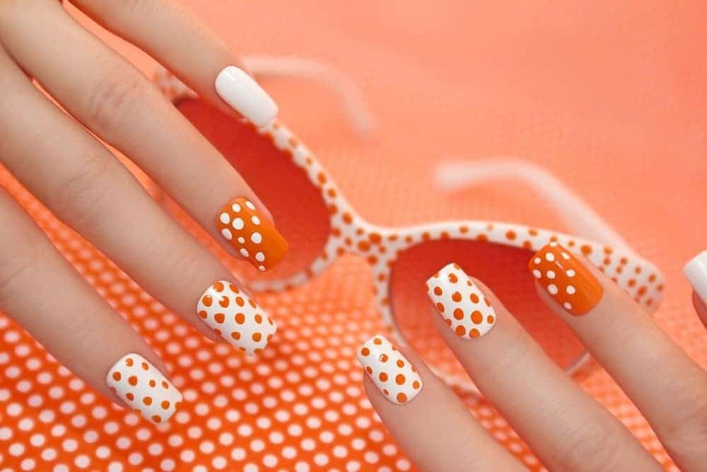 beautiful orange dot nail idea for women 