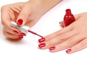 Long oval nails, glossy finish, bright red color, minimal art style.