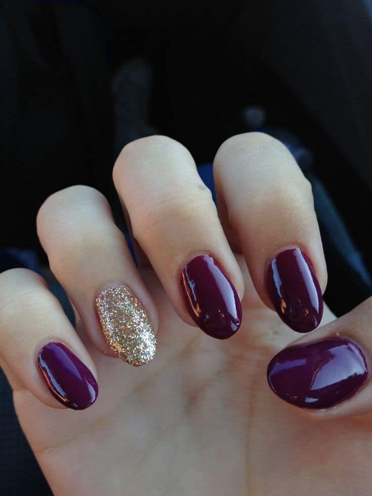 Maroon and gold nails