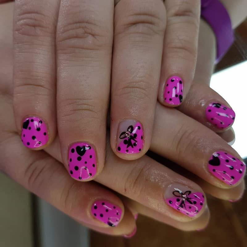 nail design with hearts and bows