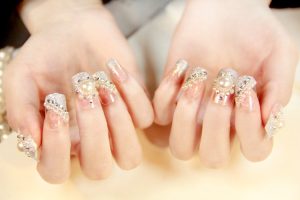 Pearl accents, rhinestones, gold glitter.