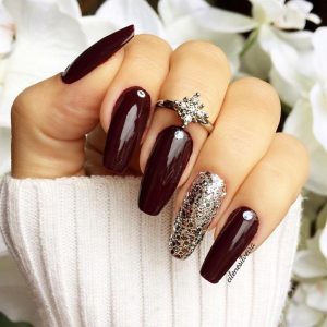 Glossy burgundy with glitter accent.