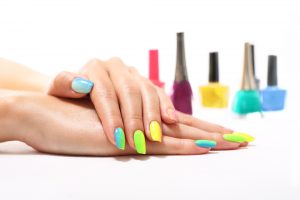 Bright, cheerful nail color palette with pastel and neon shades, glossy finish.