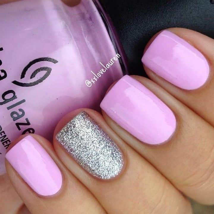 Purple nail design with glitter accent