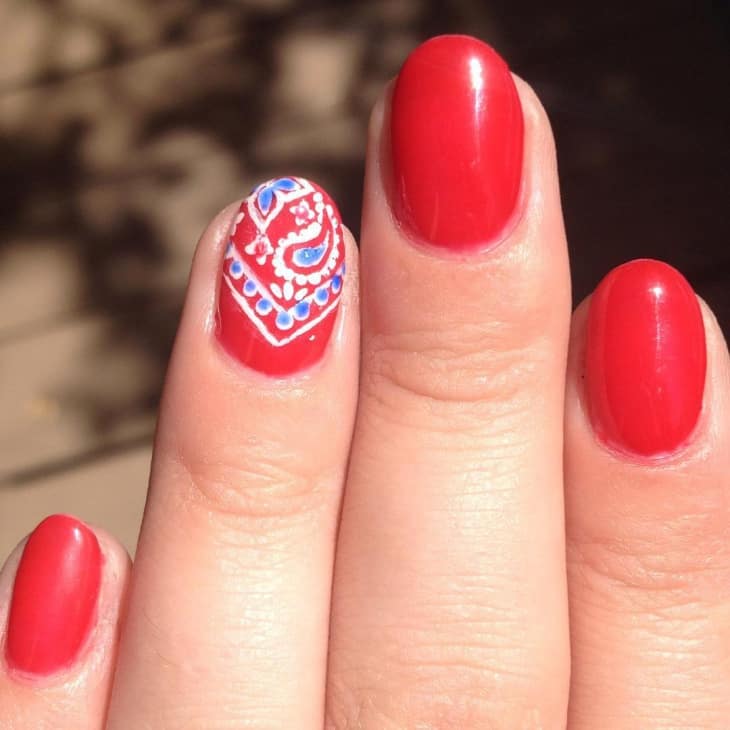 Artistic Red Round Nail Design