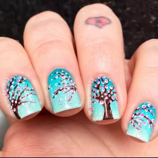 blue and brown cherry blossom nail art
