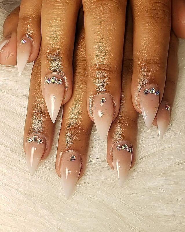 nude stiletto nails with rhinestones 