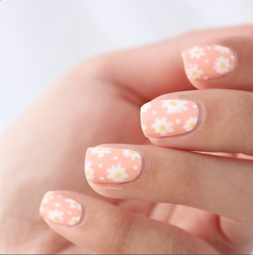 daisy nail design on pastel nail