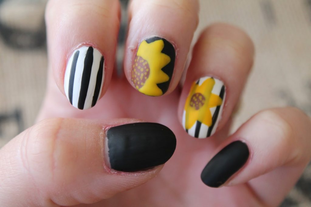 black and white sunflower nail art