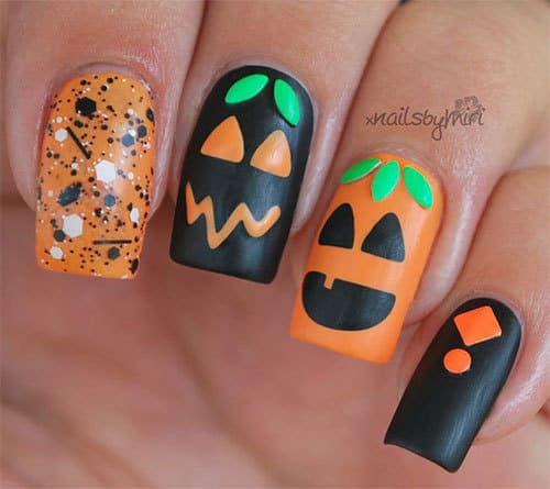 pumpkin nail art with glitters and stud