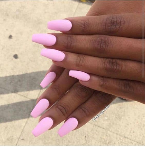 Bright pink nail on dark skin