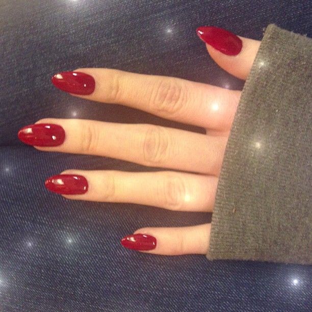 red oval shaped acrylic nail