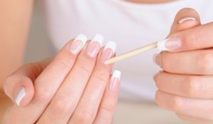 Nail shape: square, Nail length: medium, Color palette: white and natural pink, Finish: glossy, Art elements: simple white tips, Style: classic and minimalistic.