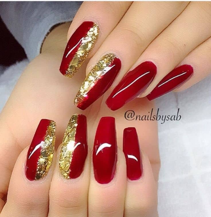 red and gold stiletto nails