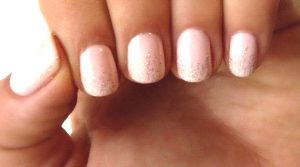 Nail shape: Rounded, length: Short, colors: Soft Pink with glitter, finish: Glossy, art: Glitter gradient, style: Elegant.