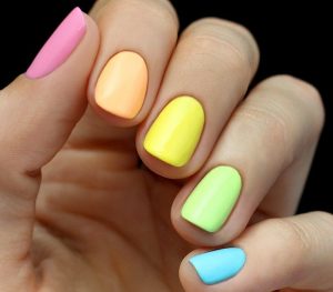 Short oval nails with glossy finish.