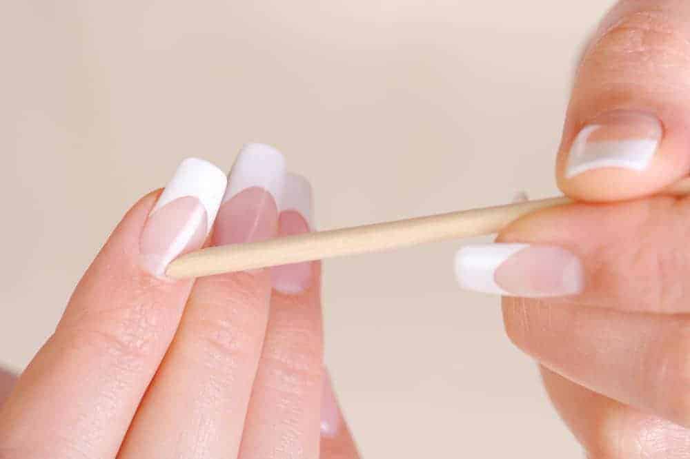 Use a Cuticle Pusher or Orange Stick