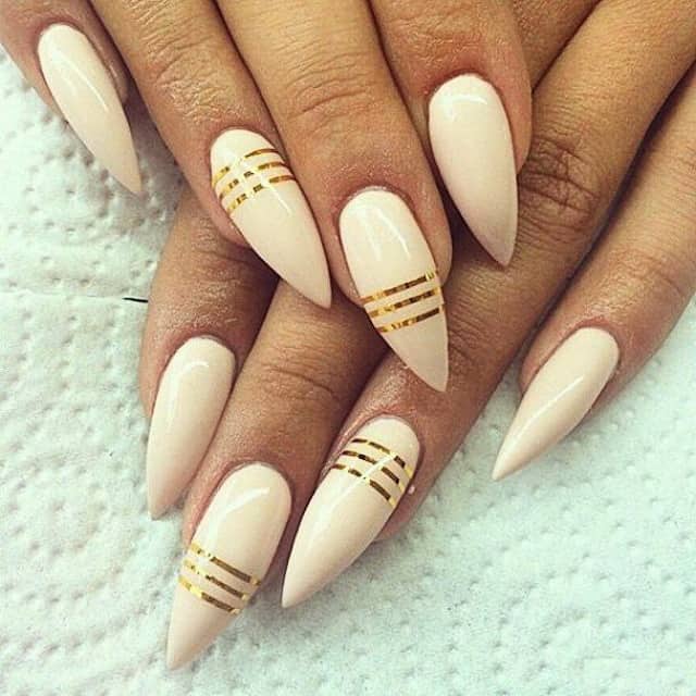 Nude nails with golden stripes