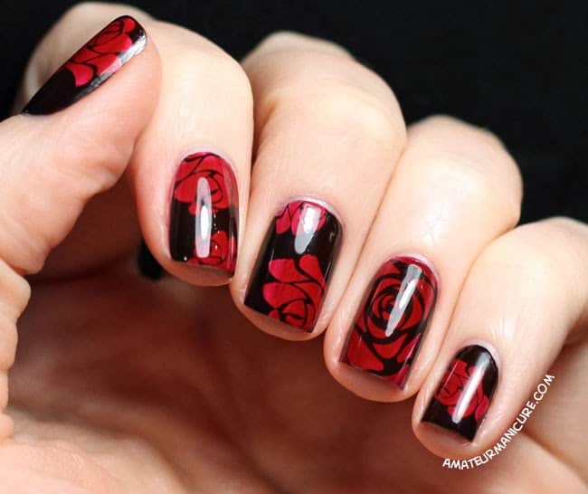 red rose on black nail