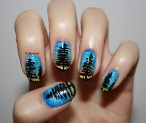 Nail shape: Oval, Long nails, Colors: Blue, green, yellow, sunset gradient, semi-glossy finish, Tree silhouette art, Nature-inspired design.