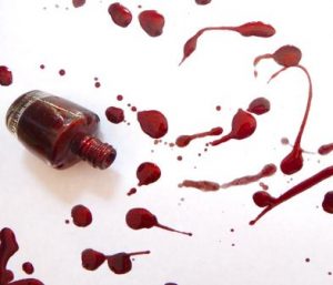 Oval, medium length, deep red color, glossy finish, no visible art, minimalist style.