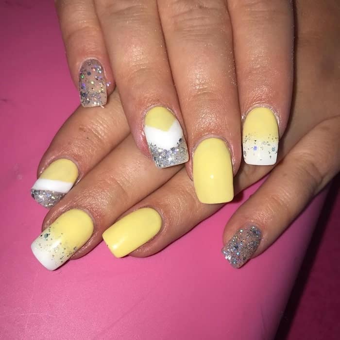 pastel yellow nails with glitter