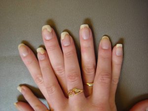 Long coffin-shaped nails with a natural finish.