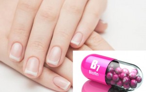 Short oval nails with glossy finish in neutral beige.