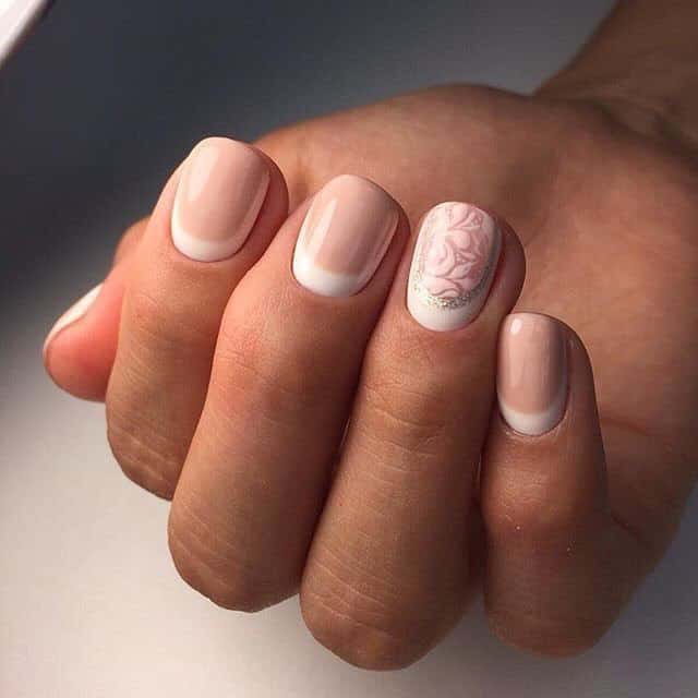 reverse french manicure with floral designs