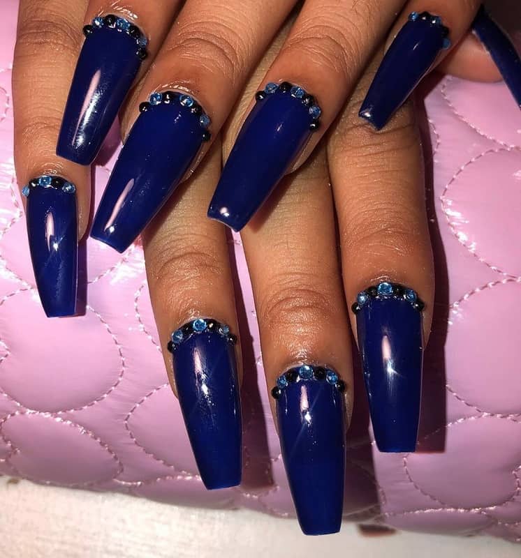 blue nail design with rhinestones