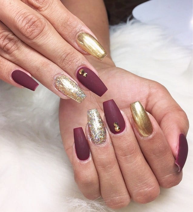 maroon and gold matte nails