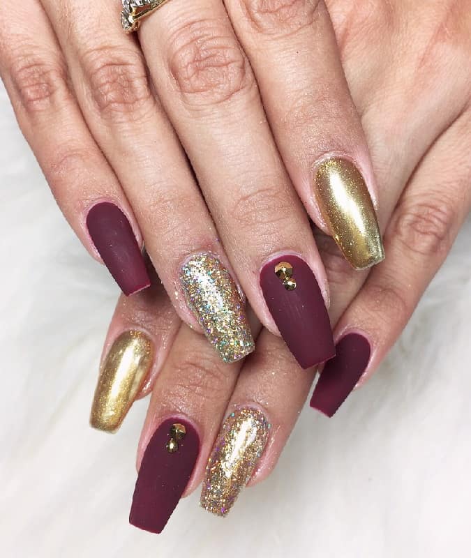 matte maroon nails with glitter