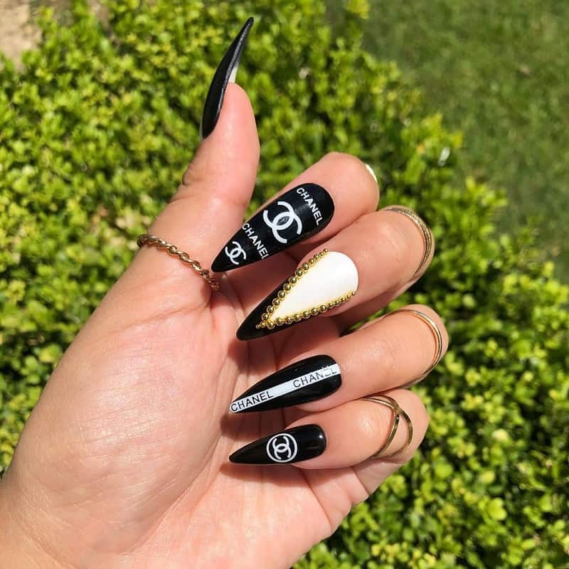 black white and gold stiletto nails