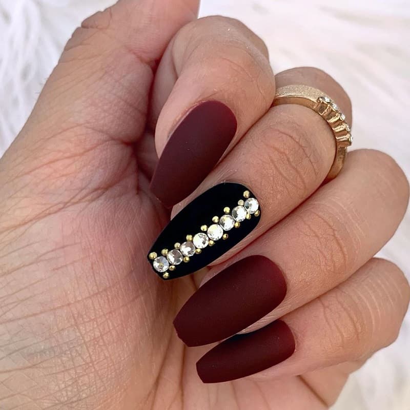 matte maroon nails with diamond