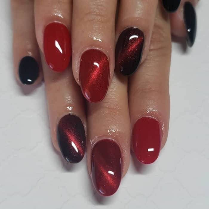 red and black cat eye nails