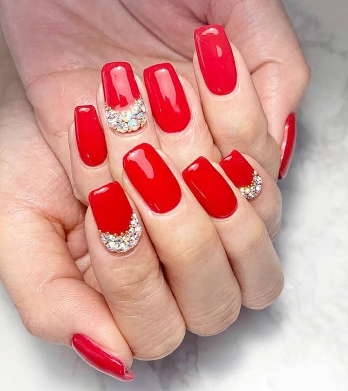 red nails with diamonds