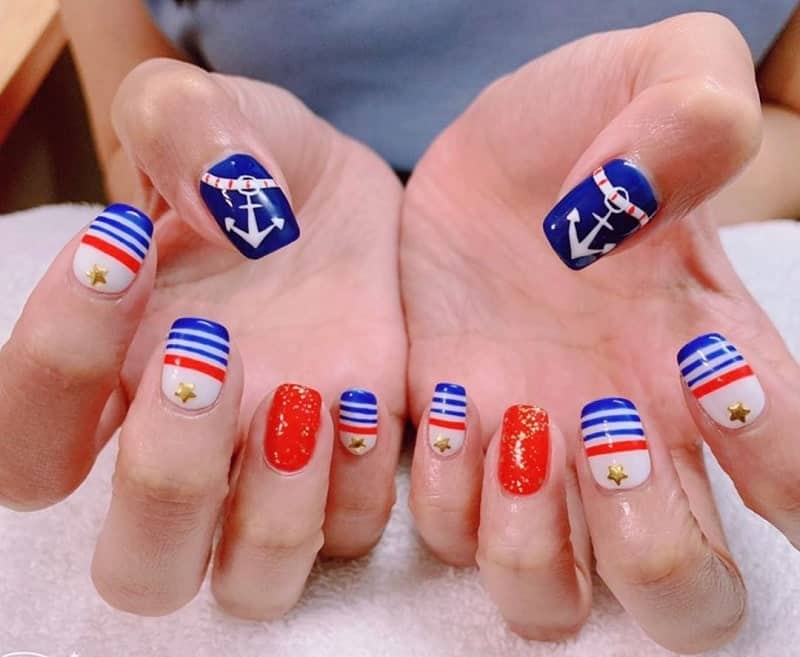 navy blue and red nail design