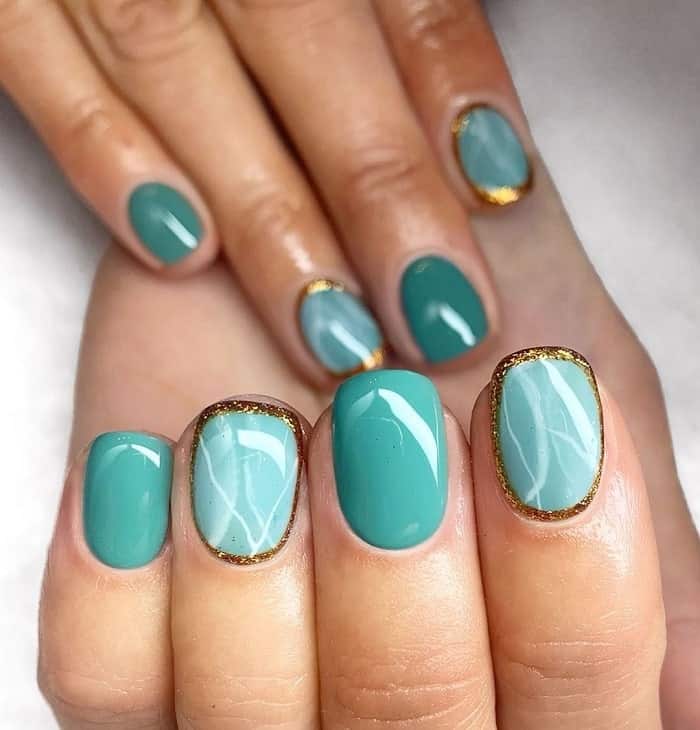 teal and gold nails