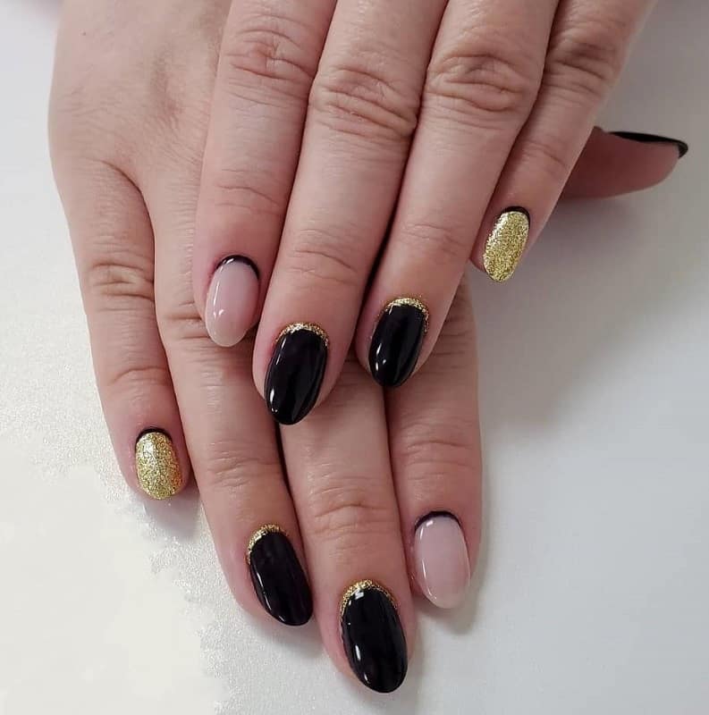black and gold reverse french manicure