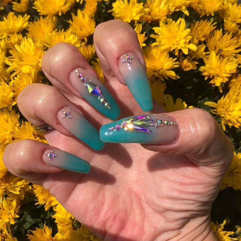 teal nails with rhinestones