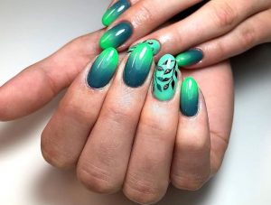 V-shaped nails, green and teal gradient, glossy, leaf art, sleek modern design.
