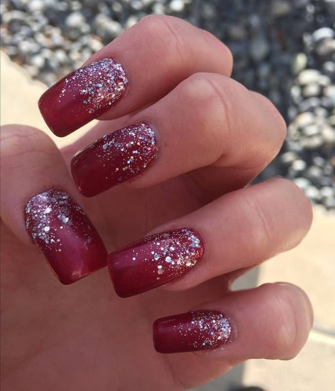 maroon nails with silver glitter 