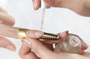 Nude, glossy finish with gold accents.