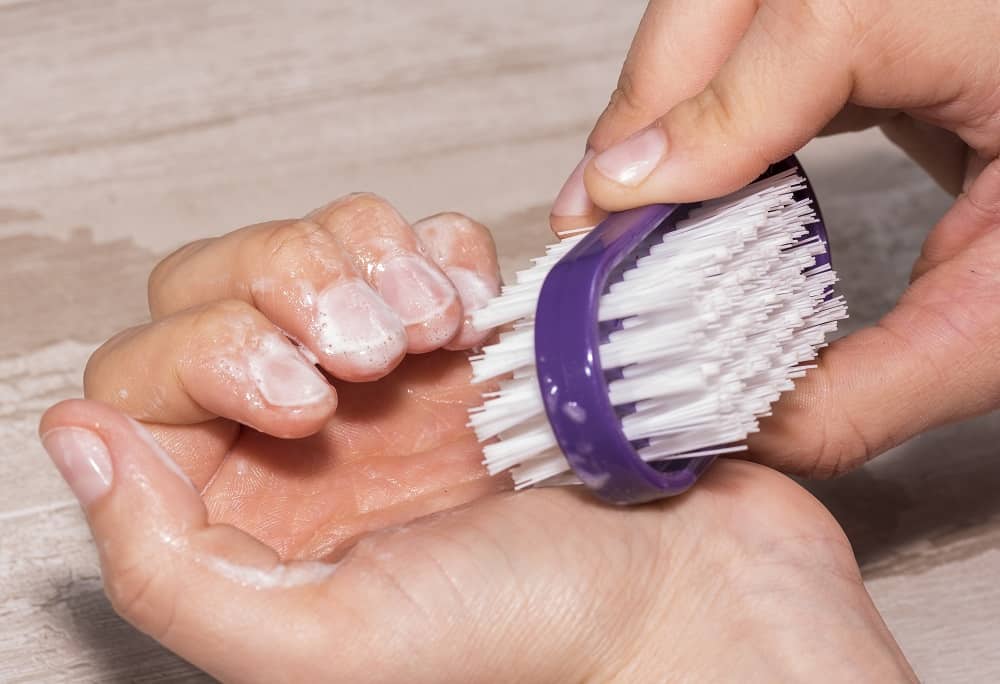 how to clean under nails - use manicure brush